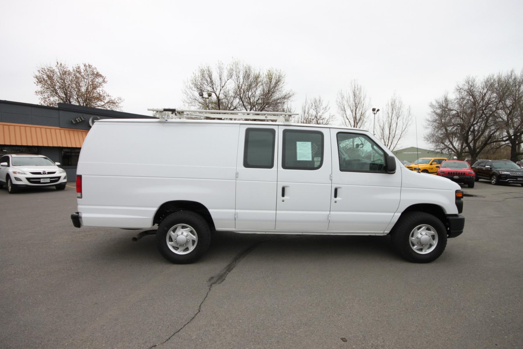 2014 White /Grey Ford E-Series Van (1FTSS3EL3ED) with an 5.4L V8 engine, Automatic transmission, located at 4562 State Avenue, Billings, MT, 59101, (406) 896-9833, 45.769516, -108.526772 - Photo #5
